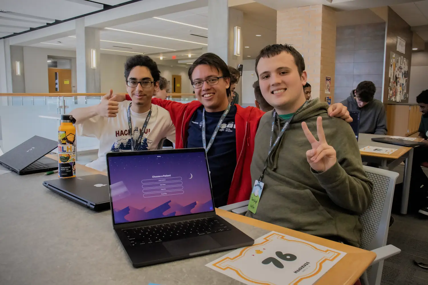 Danial, Me, and Tyler posing for a picture in front of our finished project at the judging table