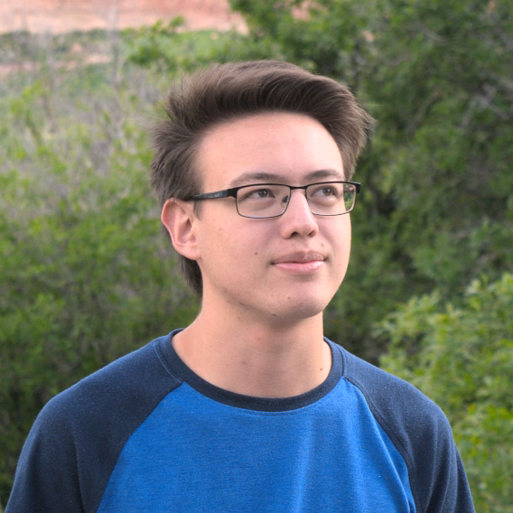 portrait of my face with blurred plants in the background